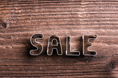 Sale composition. Studio shot on wooden background.の写真素材