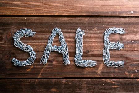 Sale composition. Studio shot on wooden background.の写真素材