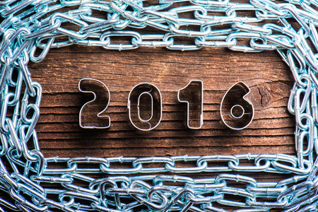 Happy new year composition. Studio shot on wooden background.