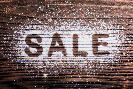 Sale composition. Studio shot on wooden background.の写真素材