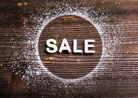 Sale composition. Studio shot on wooden background.の写真素材