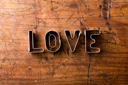 Valentines day composition. Studio shot on brown wooden background.の写真素材