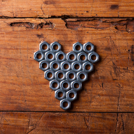 Valentines day composition. Studio shot on brown wooden background.の写真素材
