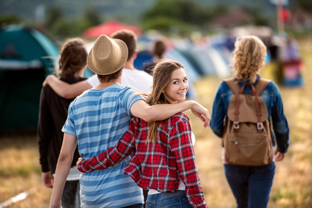 Beautiful young friends at summer tent festivalの写真素材