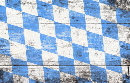 Oktoberfest background with blue and white rhombus pattern. Wooden background. Studio shot.の写真素材
