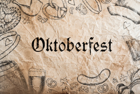 Oktoberfest sign with various hand drawn symbols, paper background. Studio shot.の写真素材