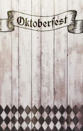 Oktoberfest sign with black and white rhombus pattern. Copy space. Wooden background. Studio shot.の写真素材