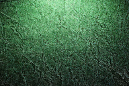 Piece of old rumpled green paper as background, empty copy spaceの写真素材