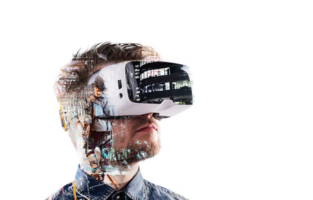 Double exposure. Man wearing virtual reality goggles. Night cityの写真素材