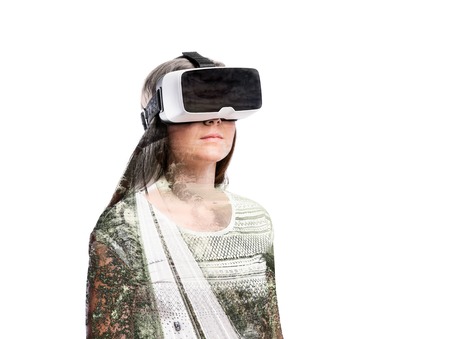 Double exposure. Woman with virtual reality goggles. Highway.の写真素材