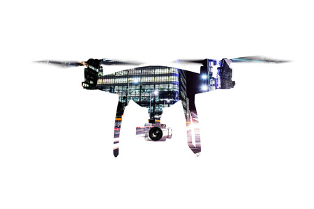 Double exposure. Hovering drone and city at night. Isolated.の写真素材