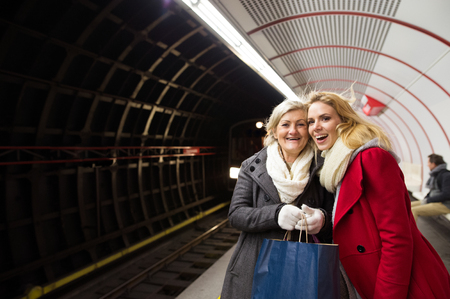 Two beautiful women at the underground platform, waitingの写真素材