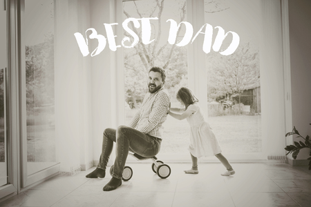 Father and daughter riding bike indoors. Fathers day concept.の写真素材