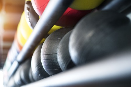 Medicine balls on shelf in modern gym.の写真素材