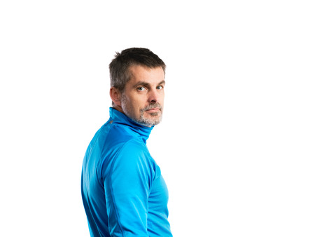 Mature hipster man in blue sweatshirt. Studio shot, isolated.の写真素材