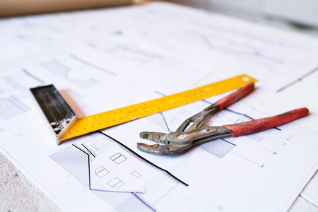 Hammer, nails on wooden boards outside on construction siteの写真素材