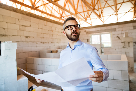 Architect or civil engineer at the construction site.の写真素材