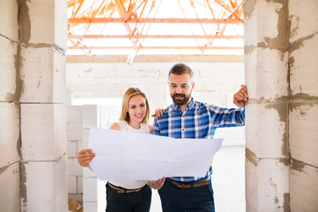 Architects and civil engineer at the construction site.