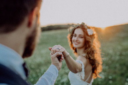 Beautiful bride and groom at sunset in green nature.の写真素材