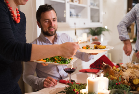 Beautiful couple celebrating Christmas.の写真素材