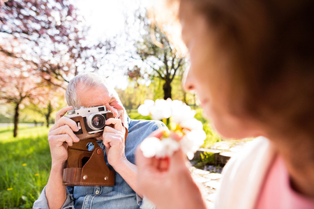 Beautiful senior couple in love outside in spring nature.の写真素材