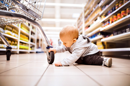 Little baby boy at the supermarket.の写真素材