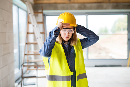 Young woman worker on the construction site.の写真素材