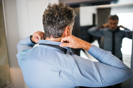 Mature businessman in a room.