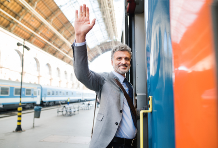 Mature businessman on a train station.