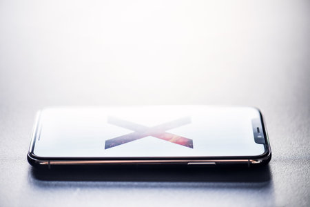 NOVA BANA, SLOVAKIA - NOV 28, 2017: New Apple iPhone X smartphone.のeditorial素材