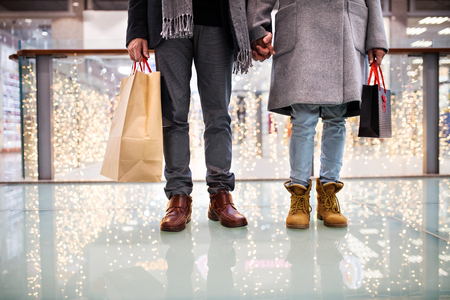 Senior couple doing Christmas shopping.の写真素材