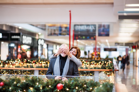 Senior couple doing Christmas shopping.の写真素材