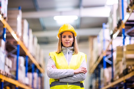 Portrait of a young woman warehouse worker.の写真素材