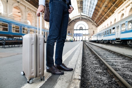 Mature businessman on a train station.の写真素材