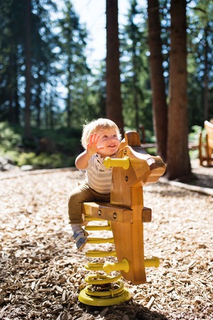 Cute little boy on the playground.の写真素材