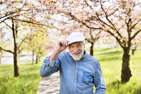 Senior man in love outside in spring nature.の写真素材