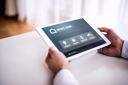 A tablet with smart home screen.の写真素材