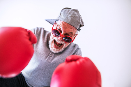 Senior man having fun at home.の写真素材