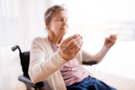 Senior woman in wheelchair at home.の写真素材