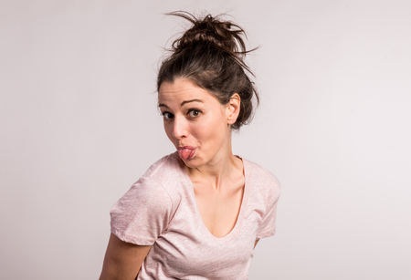 Portrait of a young beautiful woman in studio.の写真素材