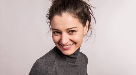 Portrait of a young beautiful woman in studio.の写真素材