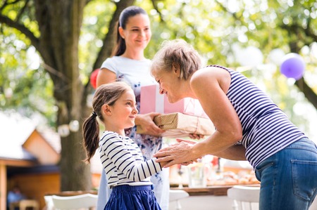 Family celebration or a garden party outside in the backyard.