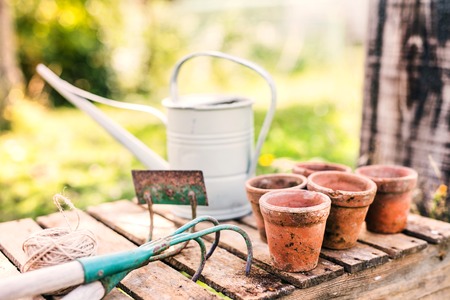 Garden tools and flower pots in the garden.の写真素材