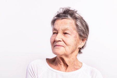 Portrait of a senior woman in studio. Close up.の写真素材