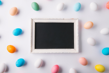 Eggs flat lay on a white background. Easter and spring composition.の写真素材