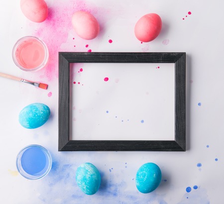Eggs flat lay on a white background. Easter and spring composition.の写真素材