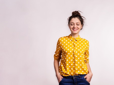 Portrait of a young beautiful woman in studio.の写真素材