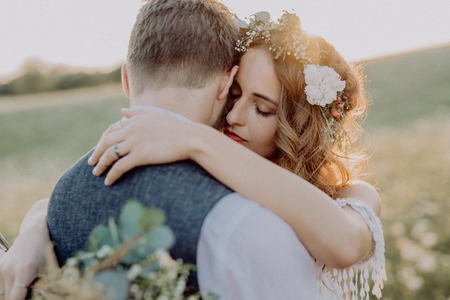 Beautiful bride and groom at sunset in green nature.の写真素材