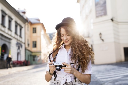Young tourist with camera in the old town.の写真素材