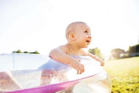 Little baby boy in the swimming pool.
